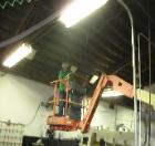 Lighting retrofits installed in factory environment.