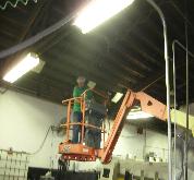 McNally Engineers electricians at factory lighting retrofit.
